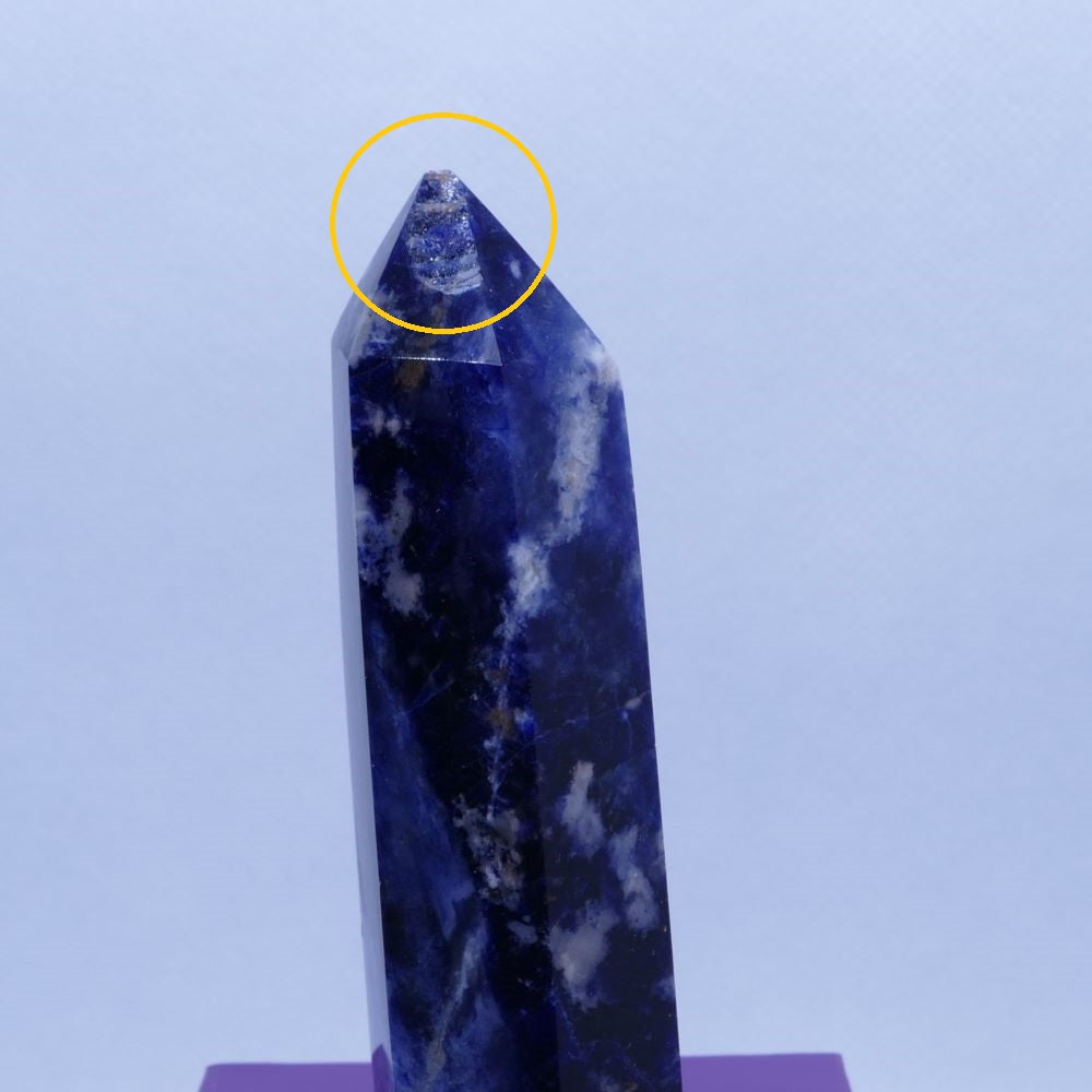 blue sodalite healing crystals tower on a purple box and white background, seller is dumi's crystals