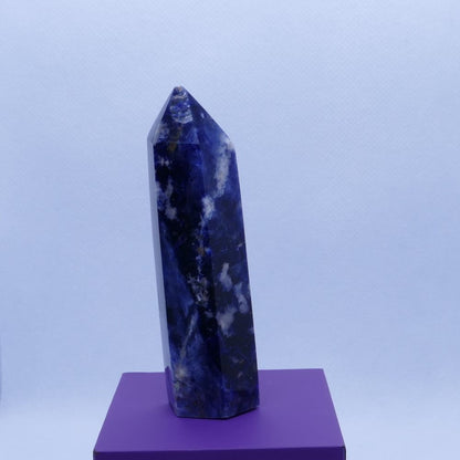 blue sodalite healing crystals tower on a purple box and white background, seller is dumi's crystals
