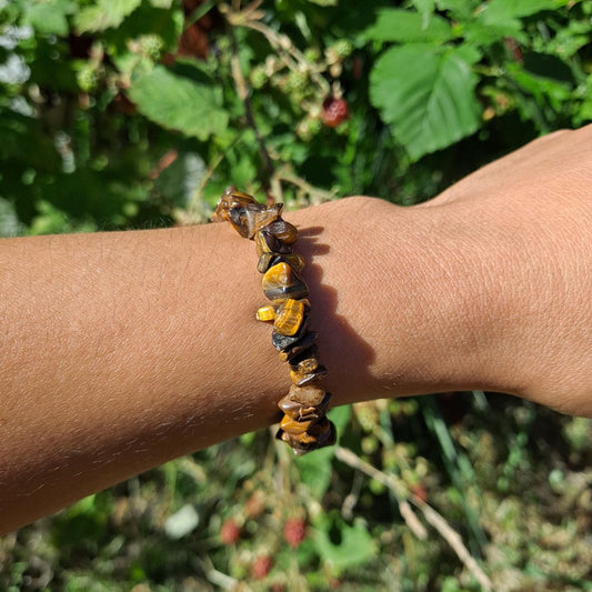 Tiger's Eye Chip Bracelet for strength and focus on wrist | Dumi's Crystals | Embrace inner peace and grounded energy with this Tiger's Eye chip bracelet. Unique chip variations, promotes courage, protection, and clear thinking.
