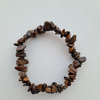  7-Inch Tiger's Eye Chip Stretch Bracelet | Dumi's Crystals | Unique Tiger's Eye chips strung on a durable stretch cord. This bracelet is believed to promote strength, confidence, protection, mental clarity, and peace.