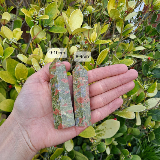 Dumi's Crystals | Unakite Towers (8-10cm) | A collection of captivating Unakite Towers (8-10cm), each with variations in their beautiful green and pink hues. Available in two sizes (8-9cm and 9-10cm), these towers promote emotional balance, inner peace, and spiritual growth.