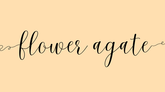 the words flower agate on beige background