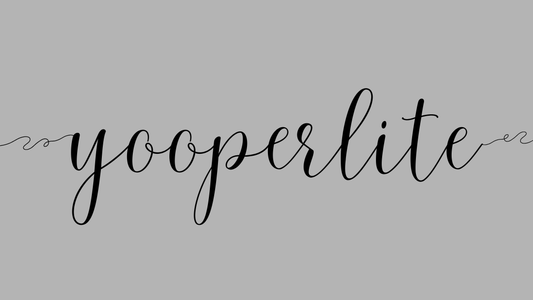 the word yooperlite on a grey background