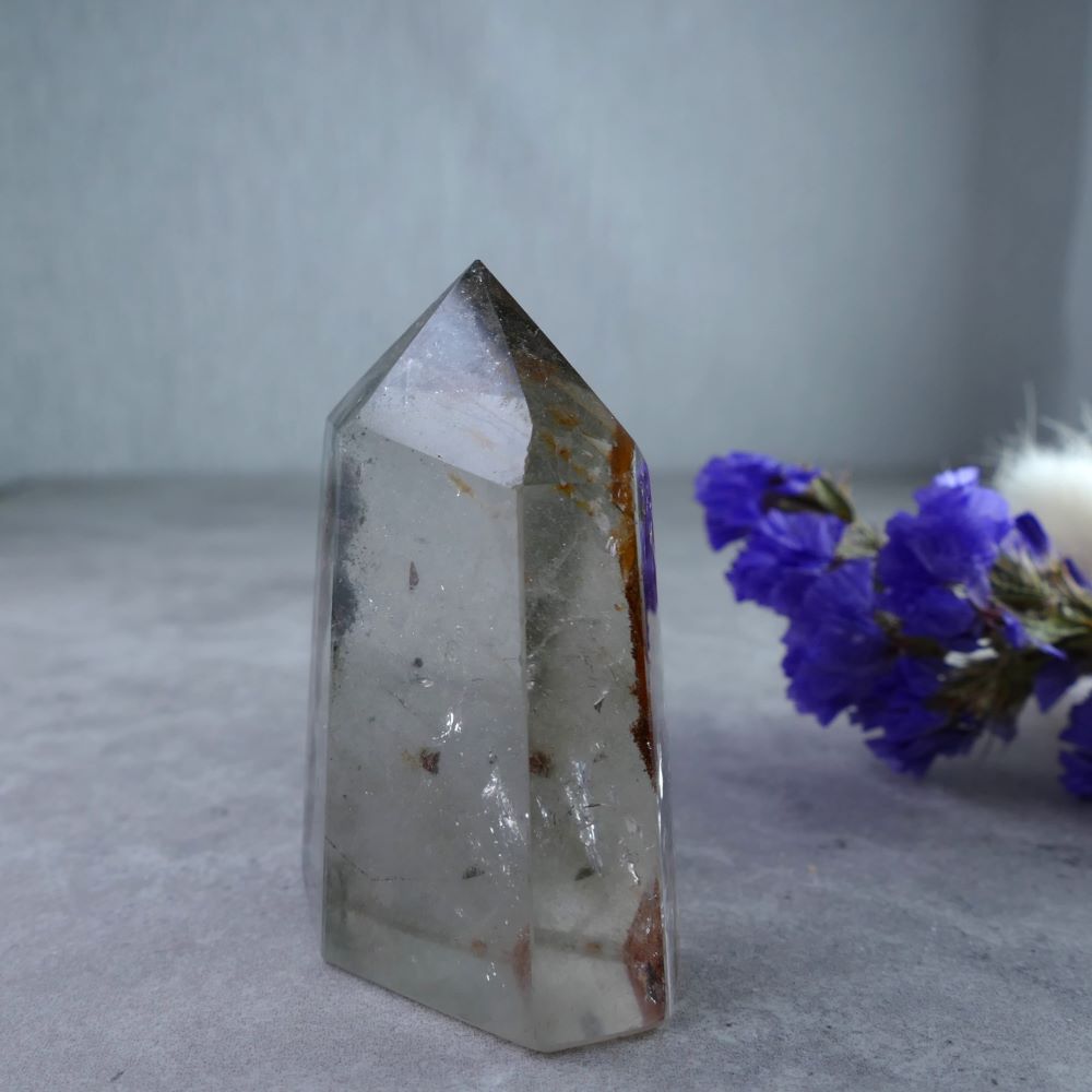 Captivating Garden Quartz Tower - Dumi's Crystals (5.2cm). A miniature garden encased in crystal. Perfect for display or meditation.