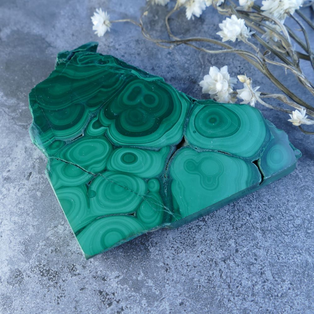 Embrace Malachite's Raw Beauty! Dumi's Crystals Slab (9cm x 9cm x 1cm). Natural, unpolished malachite with stunning green hues for emotional healing, protection, and spiritual awakening. 