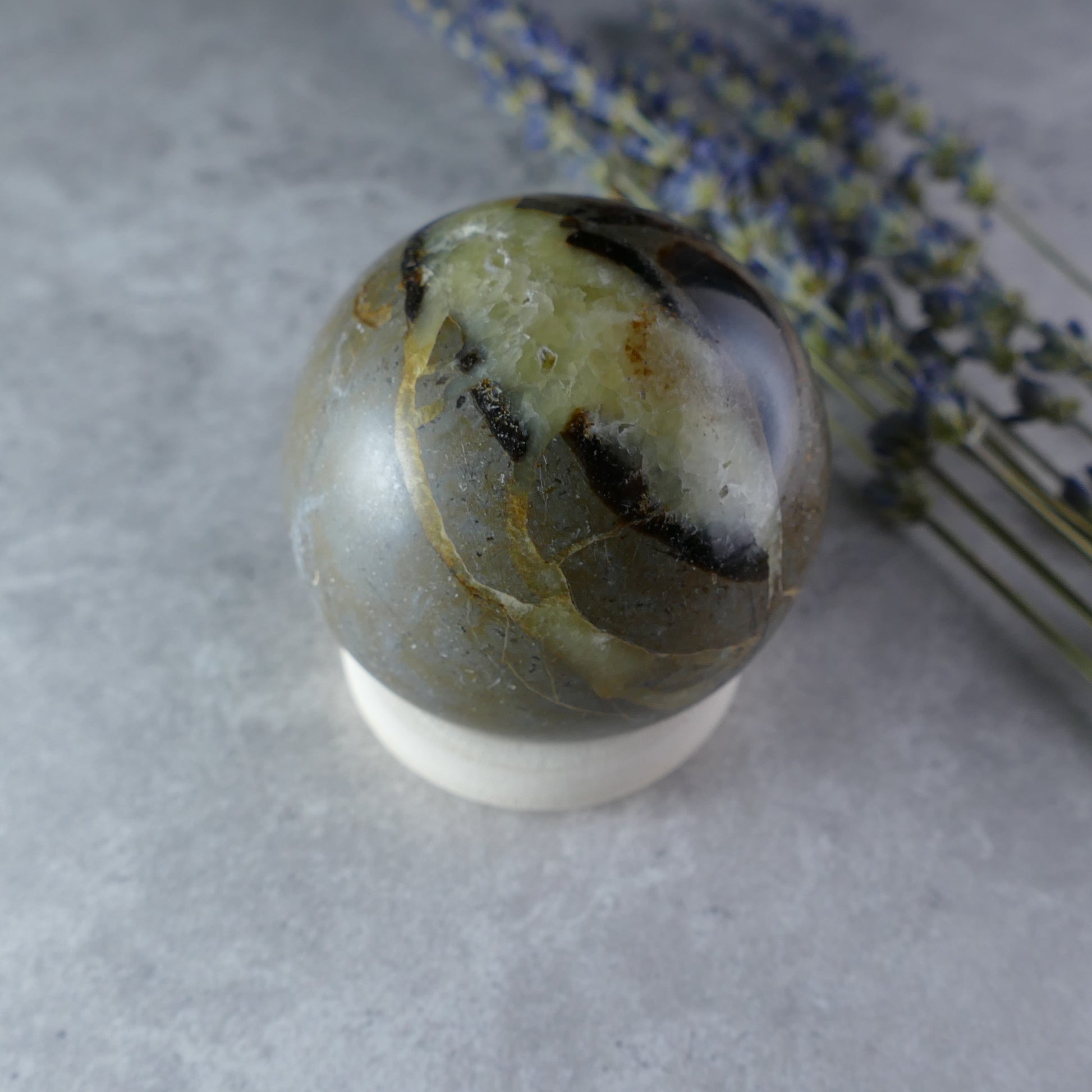 Whispers of the Earth - Dumi's Crystals Septarian Sphere (52mm, 187g). Golden calcite, brown aragonite, and grey limestone in captivating patterns tell the story of the Earth.  