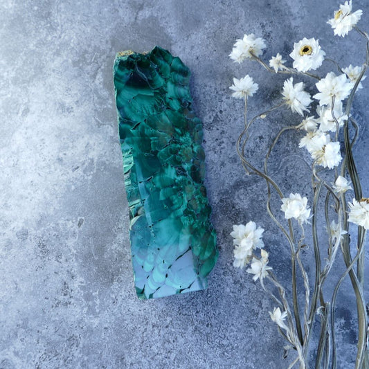 Dumi's Crystals - Malachite Transformation Prism (11.5cm, 3cm x 4.5cm x 3cm base). Striking geometry meets captivating green malachite! Unpolished edges reveal raw beauty for healing, protection, and spiritual growth.  
