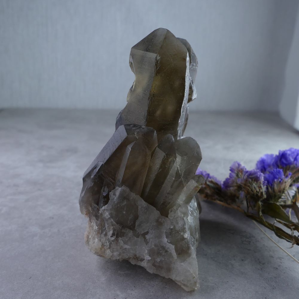Unleash Inner Strength with Dumi's Crystals (8cm, 206g). Smoky Quartz Pillar Cluster in rich hues promotes grounding & positive transformation.