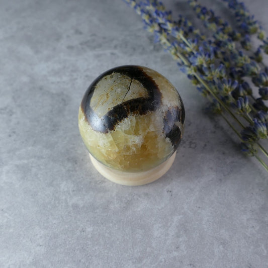 Dumi's Crystals Mini Septarian Sphere (43mm, 110g) - Earth's Calming Comfort! Carry peace with you. Golden calcite, aragonite & limestone in captivating patterns promote well-being on-the-go.