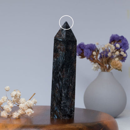 Arfvedsonite tower on wooden plate
