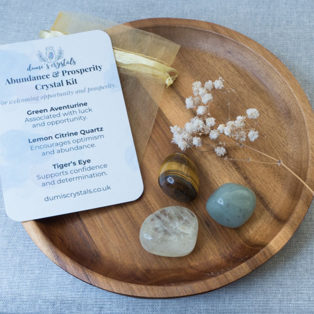 abundance Crystal kit with stones and card on a wooden tray