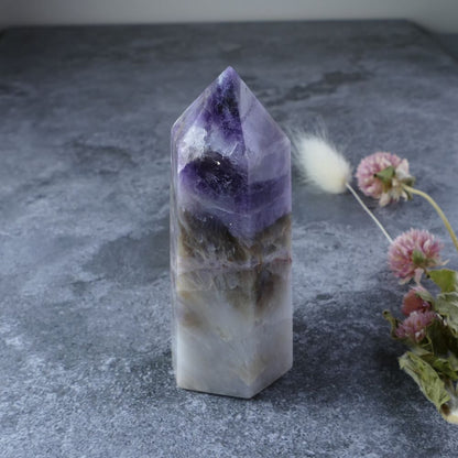 Elevate your sacred space with this Amethyst, White Quartz, and Smoky Quartz tower. Promotes harmony and well-being.
