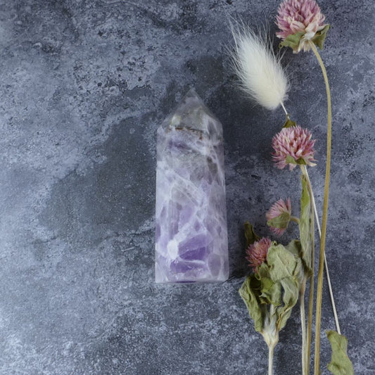 Amethyst and Quartz Tower radiating calming purple and clear hues. Ideal for meditation, energy work, or home decor.