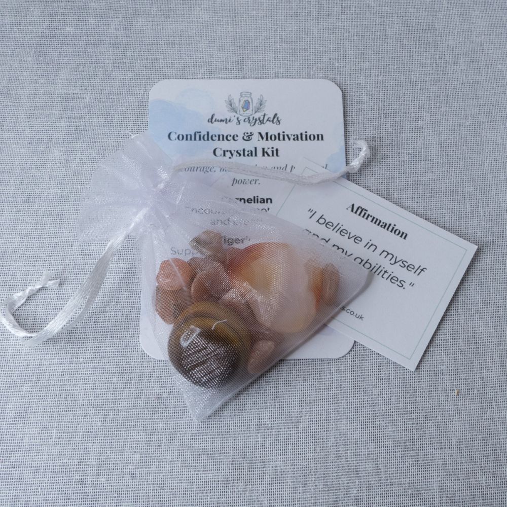 confidence Crystal kit with stones and cards on a textured surface