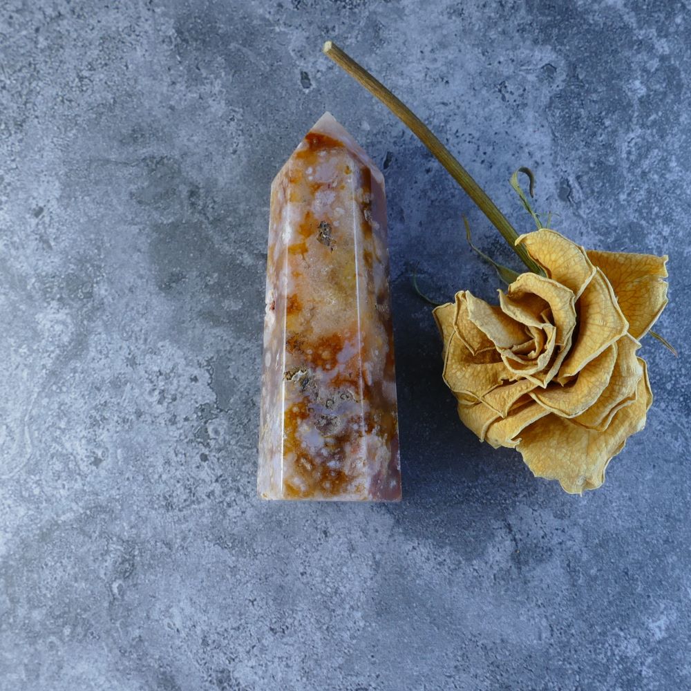 Red Flower Agate Crystal Tower - Dumi's Crystals offers a stunning Red Flower Agate tower, known for its beauty and healing properties. Enhances creativity, fosters balance, and inspires the spirit.