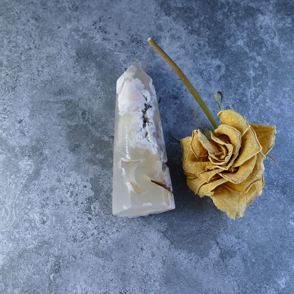 Pink and white Flower Agate Crystal Point. Dumi's Crystals. Pointed flower agate crystal tower with a smooth polish, measures 8.5cm tall, 2.6cm wide, and weighs 82 grams.