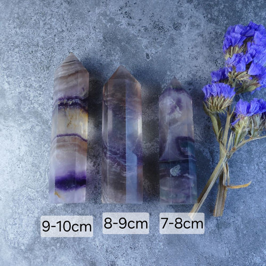 Deep Purple Fluorite Crystal Tower - Captivating tower featuring rich purple hues, known for its calming energy and ability to reduce stress and anxiety.
