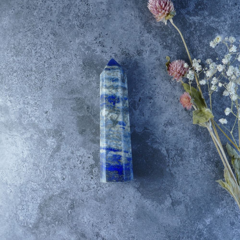 Lapis Lazuli Gemstone Tower - Dumi's Crystals offers a stunning Lapis Lazuli tower, a powerful stone for spiritual growth. Fosters clarity, awakens wisdom, and encourages honest communication.