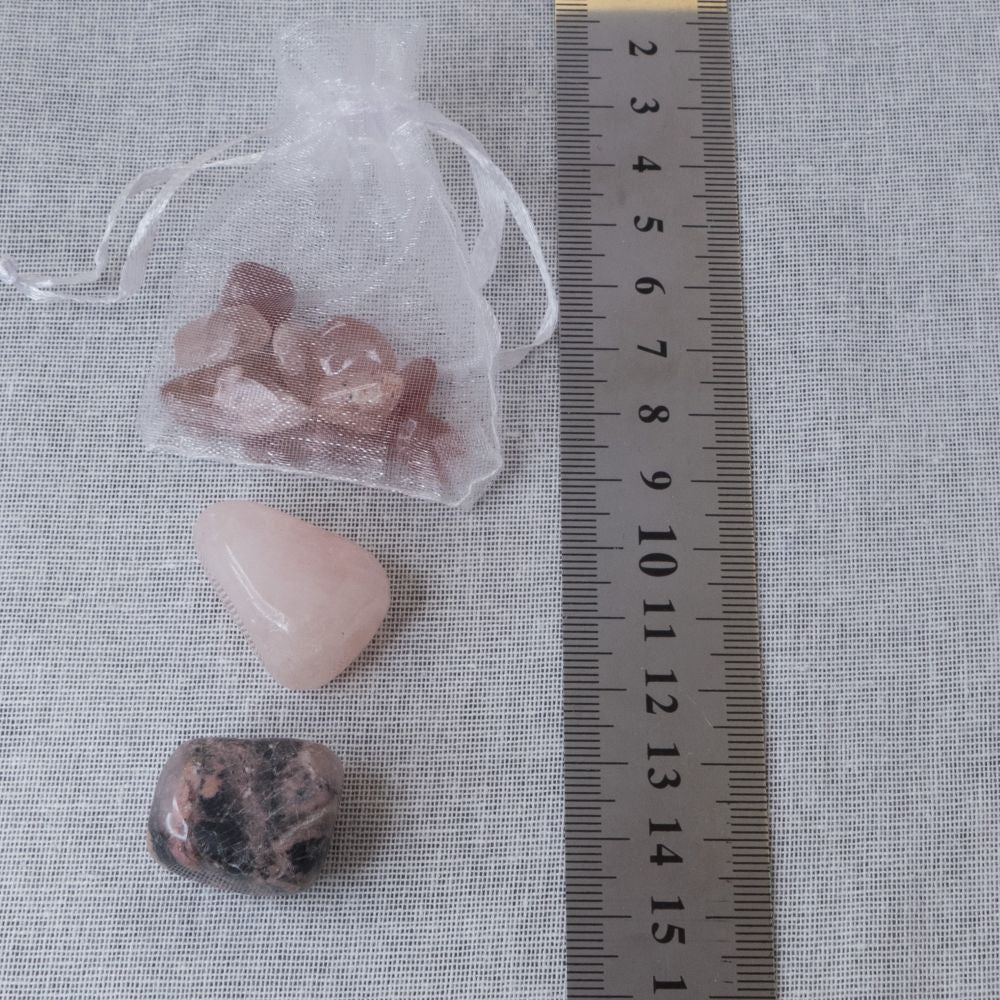crystals on a white fabric background with a ruler for scale.