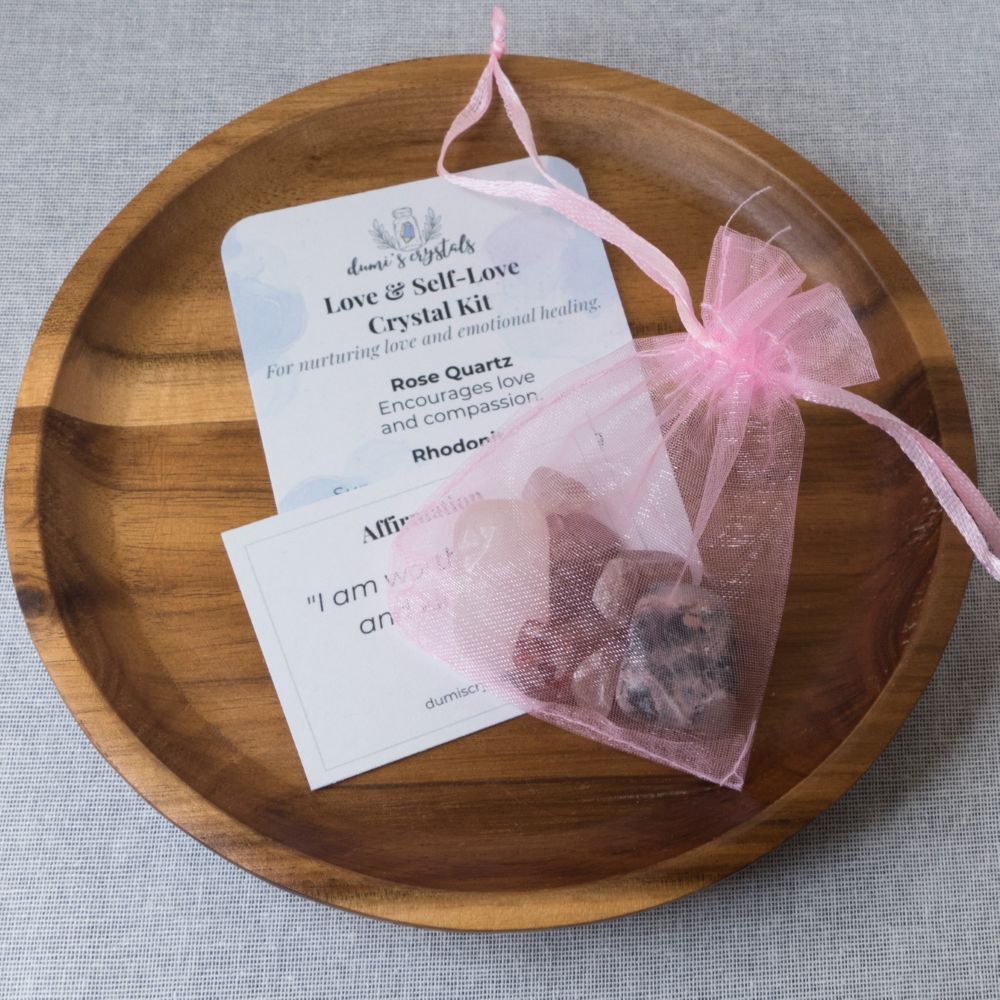 Love & Self-Love Crystal kit with rose quartz on a wooden plate