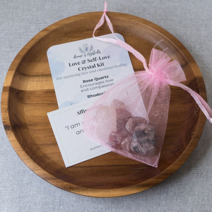 Love & Self-Love Crystal kit with rose quartz on a wooden plate