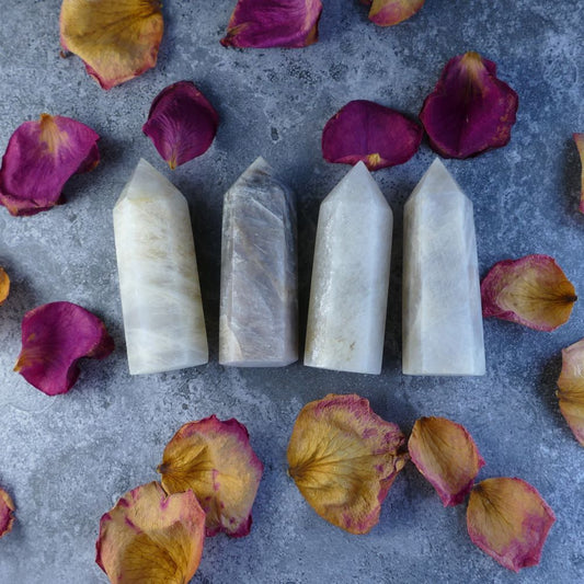Glowing Moonstone Tower - Shimmering tower with a mesmerizing play of light, resembling moonlight. Promotes intuition, emotional balance, and spiritual growth.