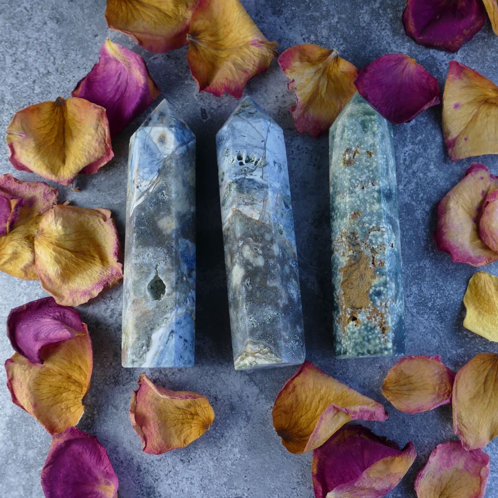 Ocean Jasper Crystal Tower - A mesmerizing tower showcasing nature's artistry with swirling blues, greens, and whites. Ideal for meditation, crystal healing, or home decor.