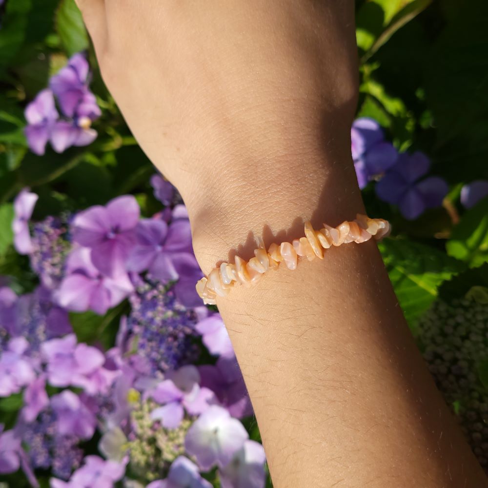 Dumi's Crystals | Peach Moonstone Stretch Bracelet | Showcasing the delicate beauty and soft, luminous glow of Peach Moonstone on a wrist. This bracelet is known for its calming energy and connection to intuition.