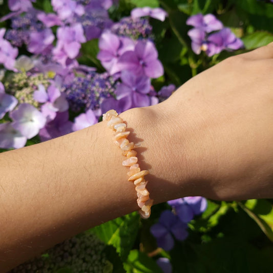Dumi's Crystals | Peach Moonstone Stretch Bracelet | Showcasing the delicate beauty and soft, luminous glow of Peach Moonstone on a wrist. This bracelet is known for its calming energy and connection to intuition.