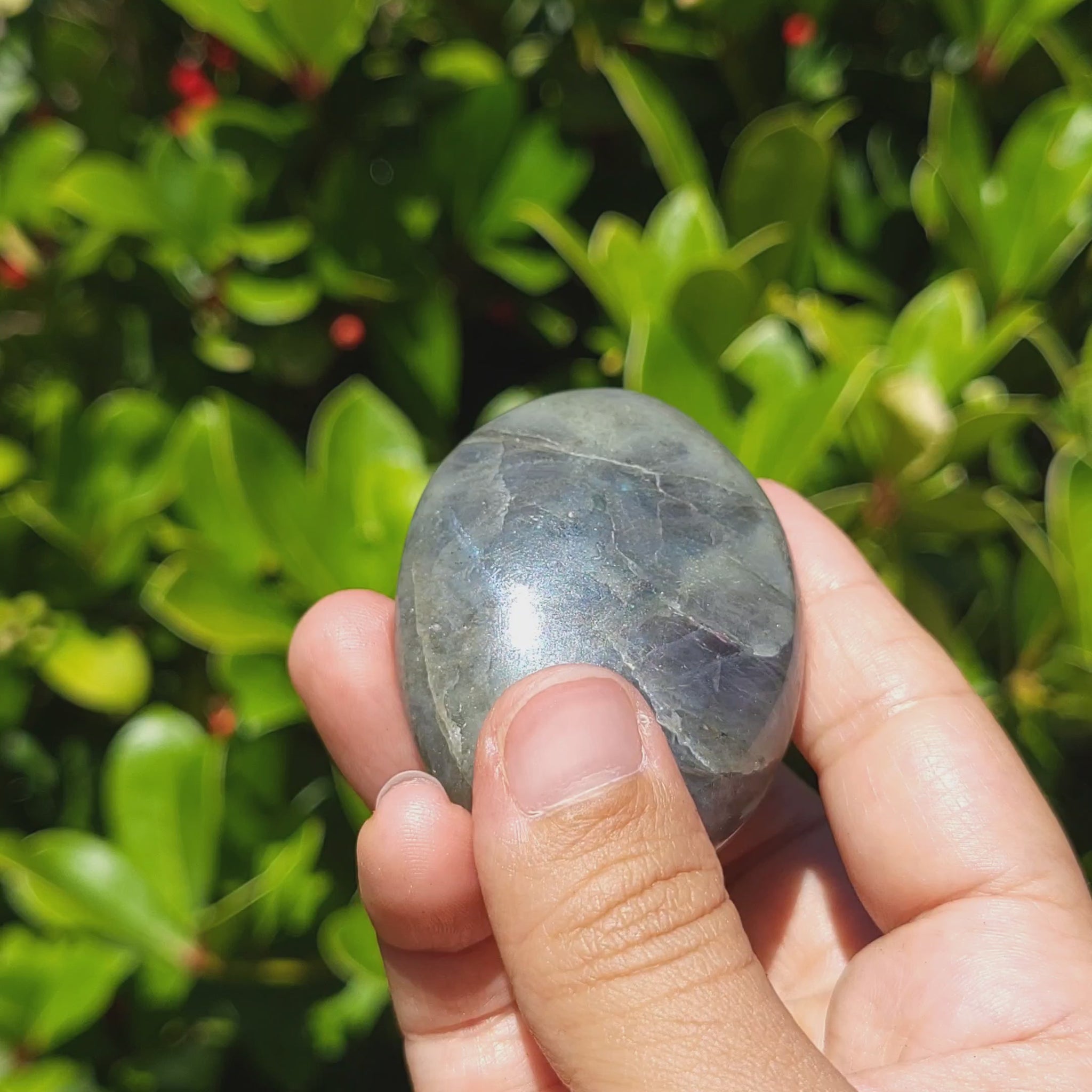 video showing a labradorite palm stone