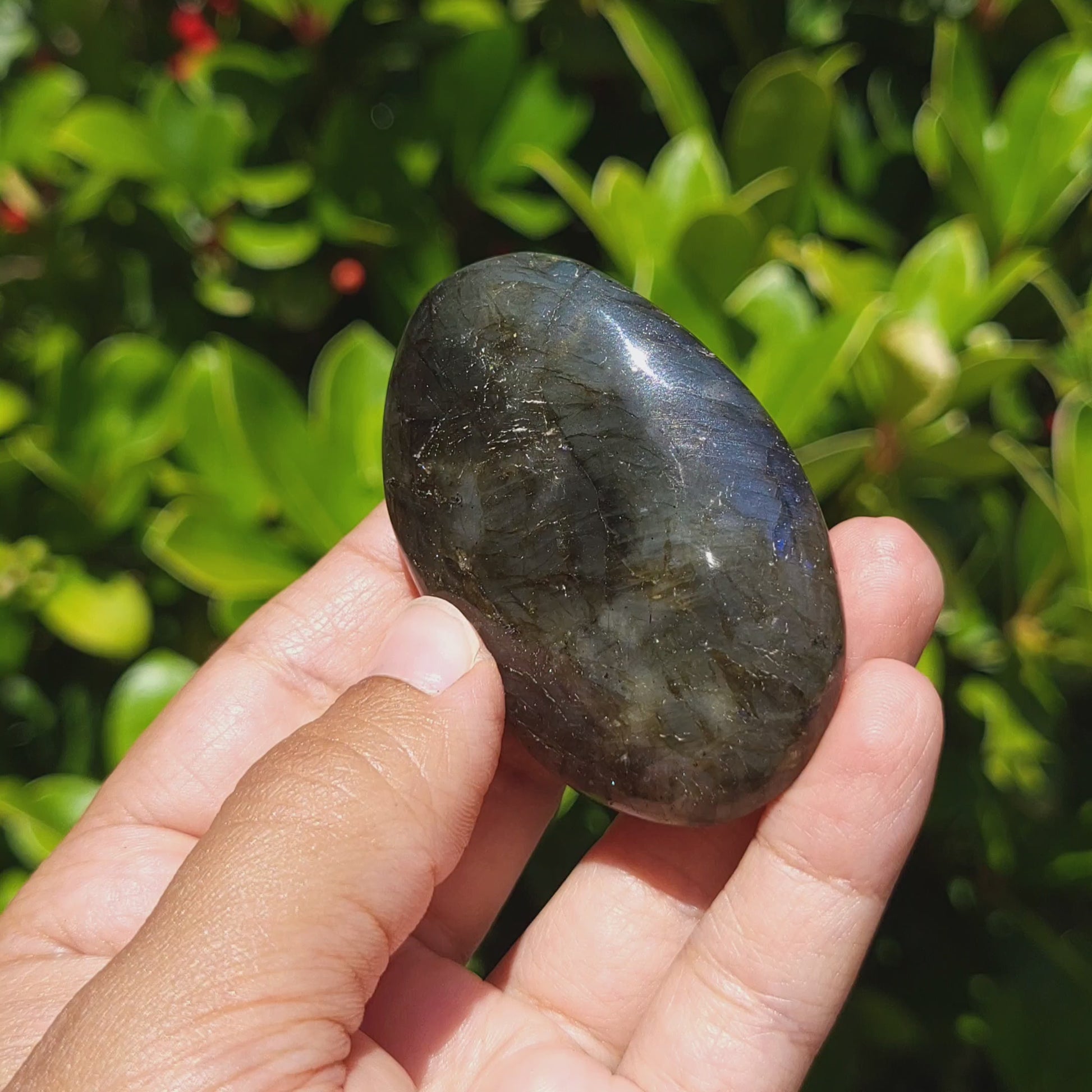 video showing a labradorite palm stone