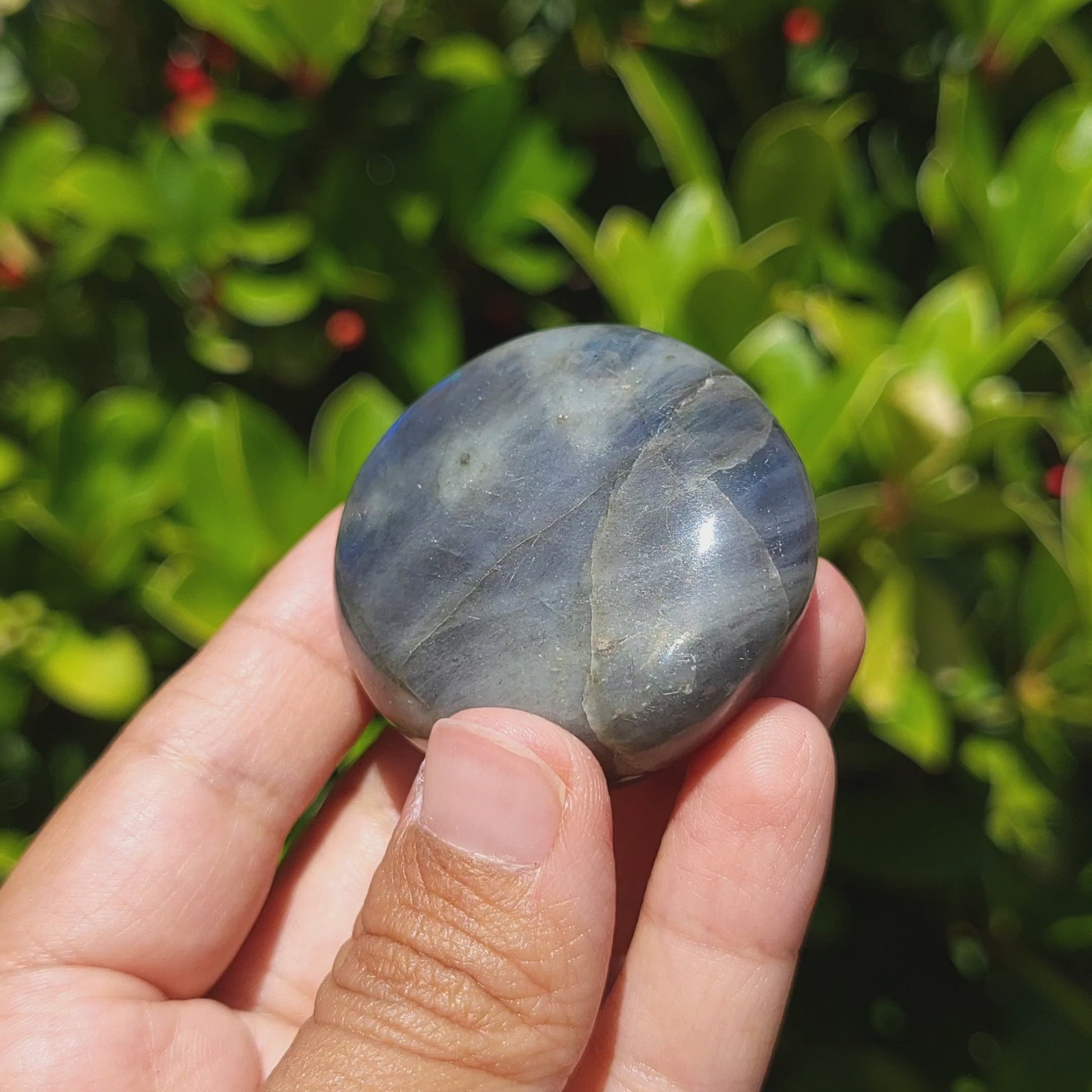 video showing a labradorite palm stone