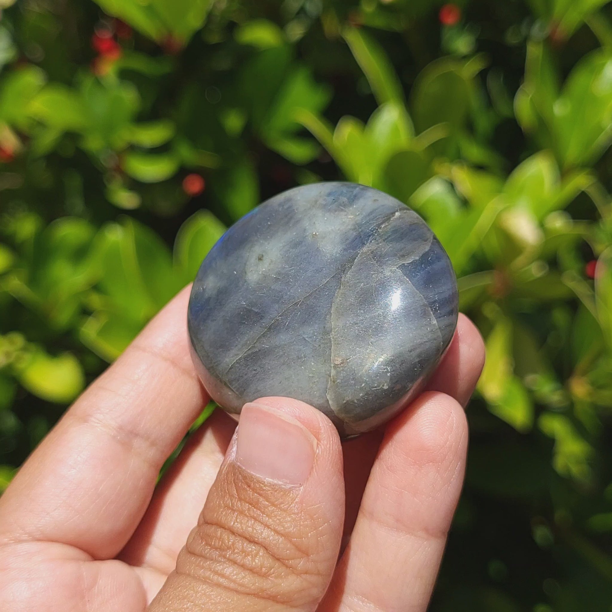 video showing a labradorite palm stone