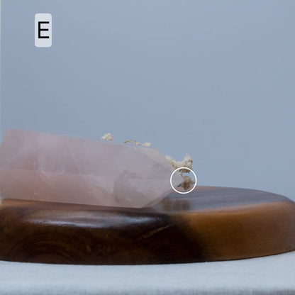 rose quartz tower on wooden plate