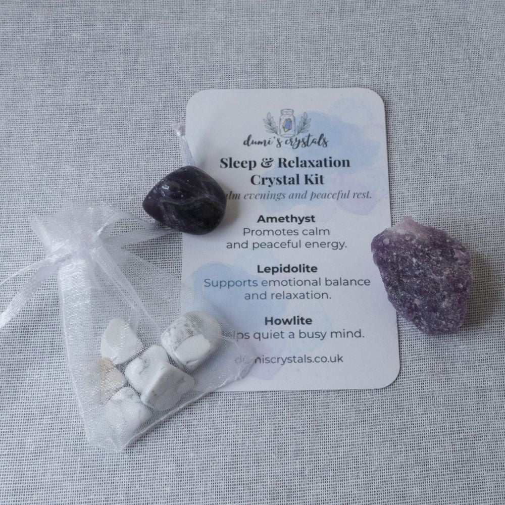 Sleep and relaxation crystal kit with stones and a card on a gray background