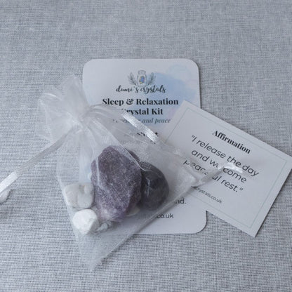 Sleep and relaxation crystal kit with stones and cards on a textured surface