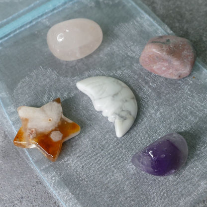 Collection of various crystals on a textured surface