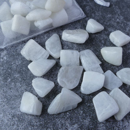 Dumi's Crystals | White Moonstone Chips (1-2.5cm) | Close-up of a collection of genuine White Moonstone chips, highlighting their soft white hues and variations in texture. White Moonstone is revered for its ability to enhance intuition, emotional balance, and spiritual growth.