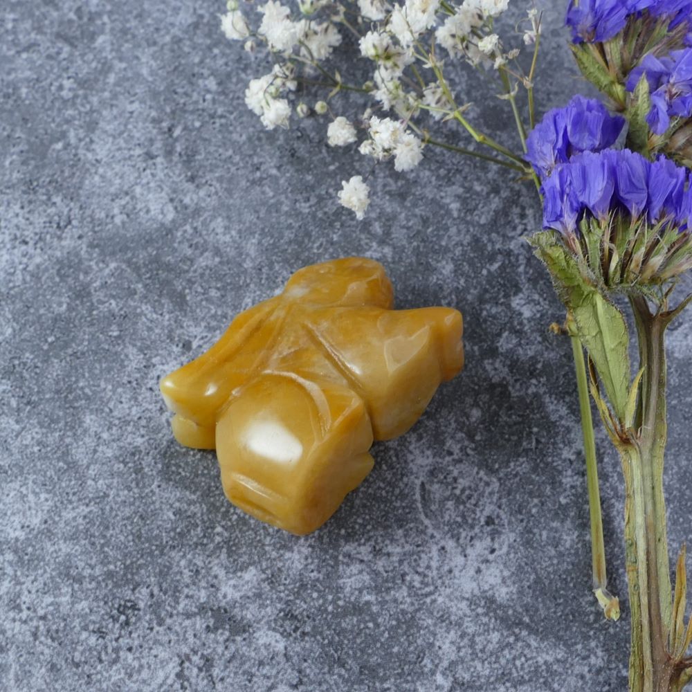 Dumi's Crystals | Yellow Aventurine Bunny Carving (Cheerful Energy):  A Yellow Aventurine Crystal Bunny Carving, a source of cheerful energy. This symbol of optimism & joy uplifts your spirits & brings sunshine into your space. Embrace happiness with Dumi's Crystals (ethically sourced).