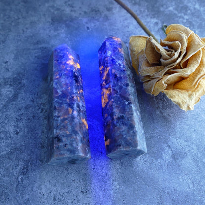Fluorescent Sodalite Tower: Natural Yooperlite crystal tower from Dumi's Crystals, known for its beauty and potential to promote inner peace and spiritual awakening.
