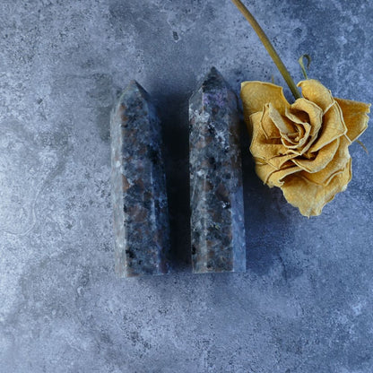 Yooperlite Tower: A mesmerizing crystal tower glowing vibrant greens and yellows, ideal for crystal healing and meditation. 