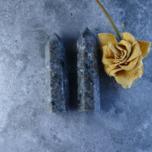 Yooperlite Tower: A mesmerizing crystal tower glowing vibrant greens and yellows, ideal for crystal healing and meditation. 