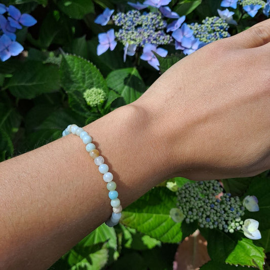 Dumi's Crystals Amazonite Stretch Bracelet. This beautiful bracelet features genuine 4mm round Amazonite beads, meticulously handcrafted and strung on durable stretch fiber for a comfortable fit. Perfect for those seeking the calming energy of Amazonite to promote balance, harmony, and well-being.