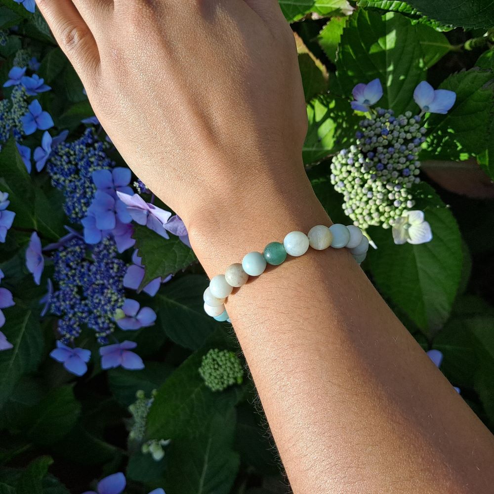 Dumi's Crystals 8mm Amazonite Bracelet: Worn on a wrist.