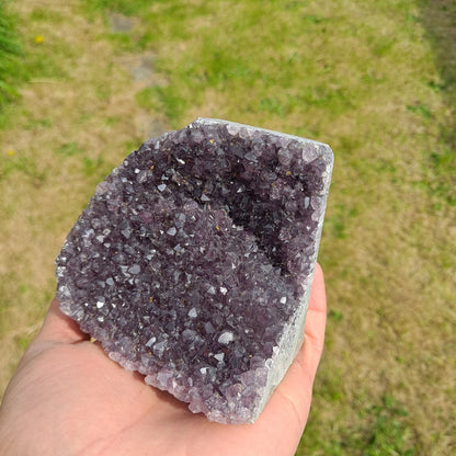 Dumi's Crystals | Amethyst Cluster (Compact, 9cm) | A close-up view of the intricate crystals within a compact Amethyst Cluster (9 x 6.5 x 9.6cm). Each cluster is a unique masterpiece of nature, with deep, calming purple hues.