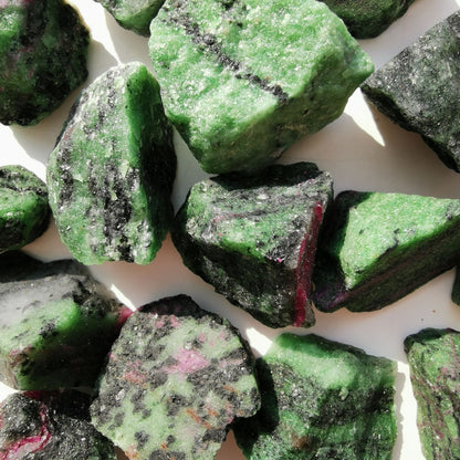 Dumi's Crystals | Rough Ruby Zoisite Crystals (Balance & Healing) | A collection of Rough Ruby Zoisite Crystals, reminders of your inner harmony. Ruby Zoisite promotes peace, well-being & spiritual growth. Scatter them in your home or workspace to create a balanced environment, welcome emotional healing & a renewed sense of vitality. Embrace the power of Rough Ruby Zoisite from Dumi's Crystals!