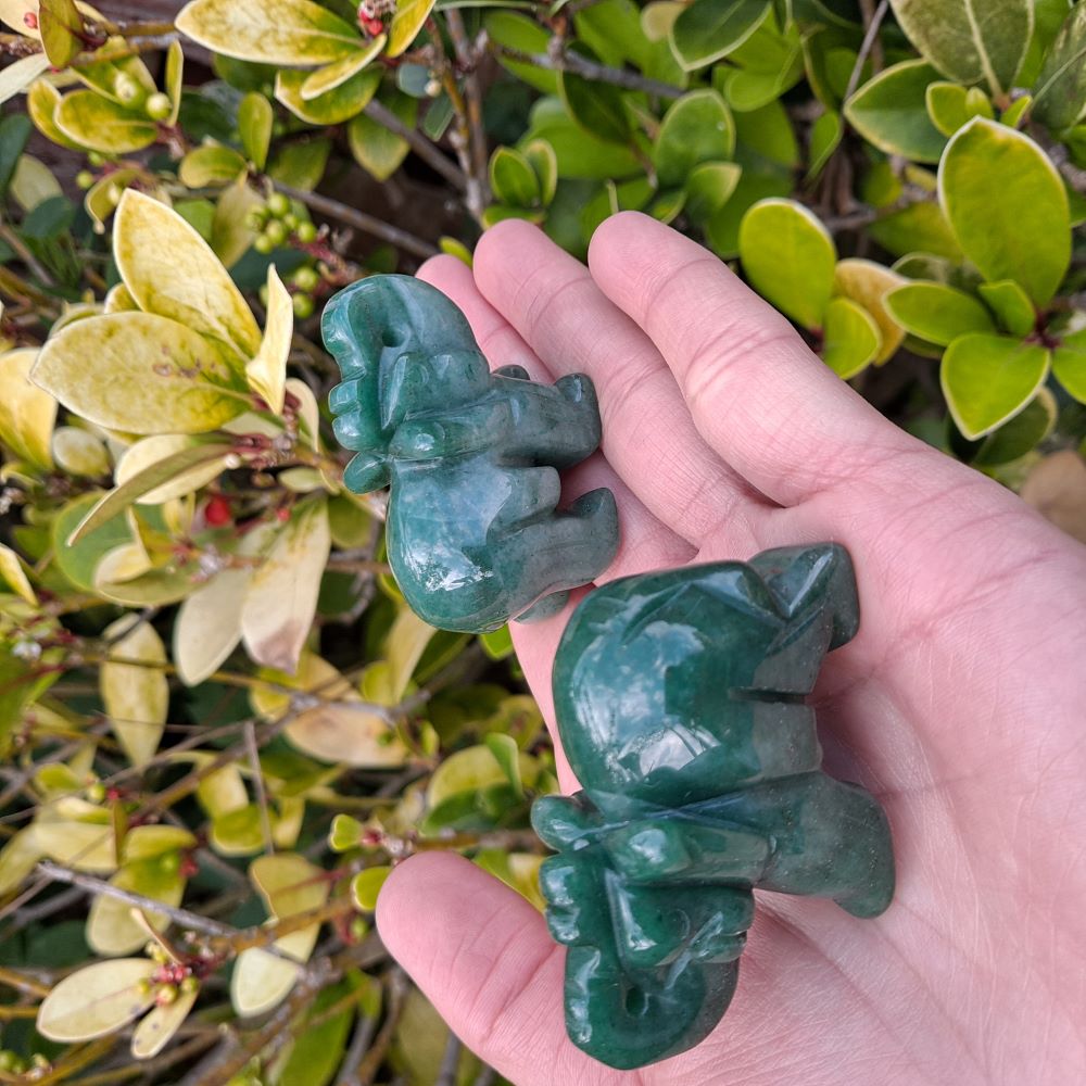 Dumi's Crystals | Green Aventurine Elephant Carving (Strength & Luck):  A handful of Green Aventurine Elephant Carvings radiate empowering energy. Symbolic of strength, good luck & prosperity, hold them during meditation or carry them throughout the day. Green Aventurine promotes emotional balance & helps manifest dreams. Embrace abundance with Green Aventurine Elephant Carvings from Dumi's Crystals!