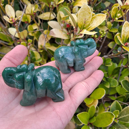 Dumi's Crystals | Green Aventurine Elephant Carving (Strength & Luck):  A handful of Green Aventurine Elephant Carvings radiate empowering energy. Symbolic of strength, good luck & prosperity, hold them during meditation or carry them throughout the day. Green Aventurine promotes emotional balance & helps manifest dreams. Embrace abundance with Green Aventurine Elephant Carvings from Dumi's Crystals!