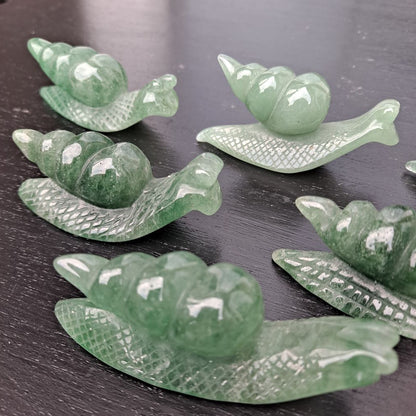 Dumi's Crystals | Green Aventurine Snail Carving (Positive Persistence):  A Green Aventurine Snail Carving, a symbol of patience and positive persistence. Hand-carved with captivating green hues, this snail promotes emotional balance & attracts abundance. Invite its calming energy into your life with Dumi's Crystals (ethically sourced).