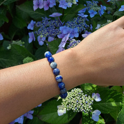 Dumi's Crystals | Lapis Lazuli Stretch Bracelet (8mm) | Showcasing the bold beauty of Lapis Lazuli on a wrist. This 8mm bead bracelet features captivating blue hues and golden flecks, promoting wisdom, inner peace, and mental focus.